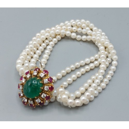 136 - A five strand pearl bracelet, the large 18ct whit and yellow gold clasp with central cabochon Emeral... 