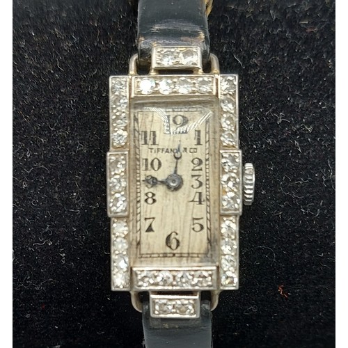 138 - A Diamond encrusted cocktail watch by Tiffany and Co. The rectangular dial with Diamond bezel and le... 