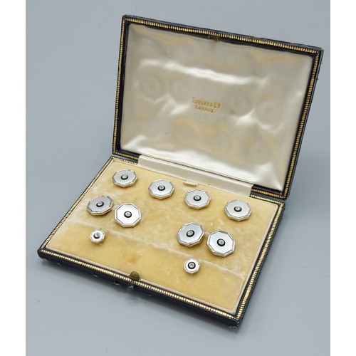 139 - A set of 18ct gold, Platinum, diamond set and Mother Of Pearl dress studs and cufflinks retailed by ... 