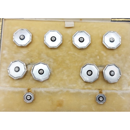 139 - A set of 18ct gold, Platinum, diamond set and Mother Of Pearl dress studs and cufflinks retailed by ... 