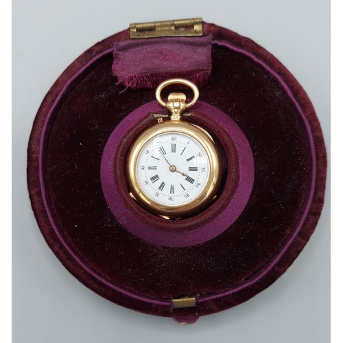 146 - A French gold fob watch, the enamel dial with Roman Numerals and with engraved case and within a lin... 