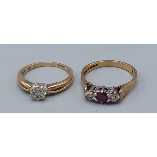 177 - A 9ct gold three stone ring set with a central garnet flanked by diamonds 2.3gms, ring size N togeth... 