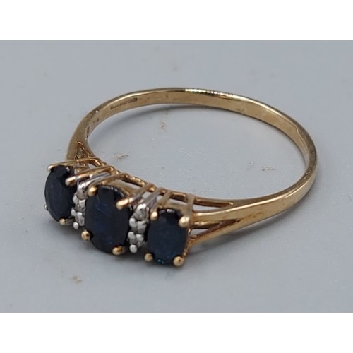 190 - A 9ct gold sapphire and diamond ring set with three sapphires interspaced with diamonds, 1.8gms, rin... 