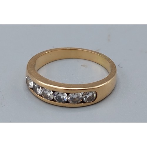 198 - An 18ct gold diamond band ring, set with six diamonds, 4.9gms, ring size P