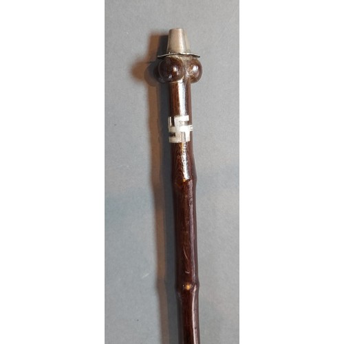 314 - An African tribal staff with white metal mounts, 126cms long