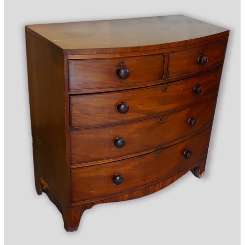 438 - A Victorian mahogany bow fronted chest of two short and three long drawers raised upon outswept legs... 