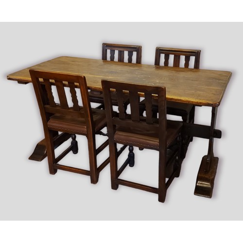 439 - An oak refectory style dining table, the plank top above twin end supports, 161cms x 76cms together ... 