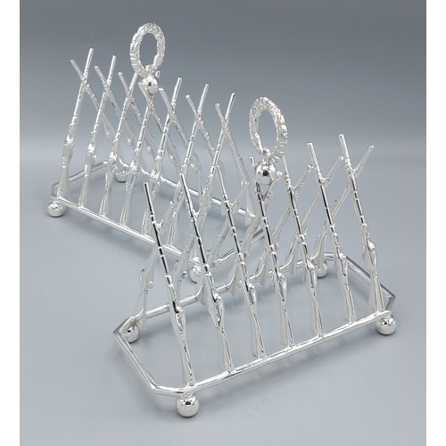 244 - A pair of six division toast racks in the form of rifles