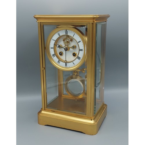 314 - A late 19th Century brass cased library clock, the enamel dial with Roman numerals and two train mov... 