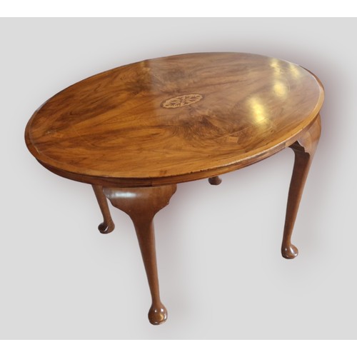 330 - A Victorian walnut and inlaid oval centre table together with a set of six dining chairs