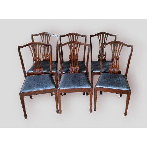 330 - A Victorian walnut and inlaid oval centre table together with a set of six dining chairs