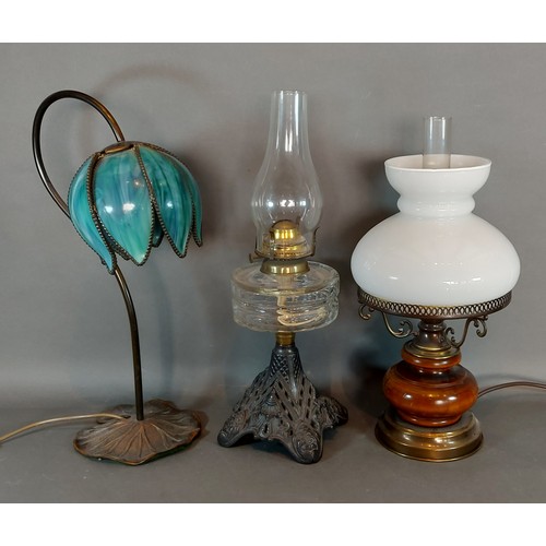 227 - An oil lamp together with two other lamps