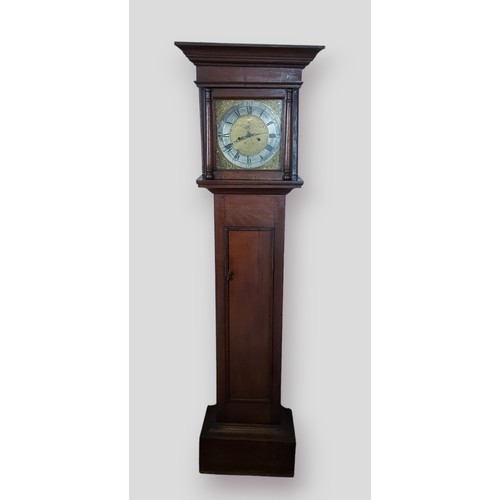 321 - A country oak longcase clock, the square hood above a rectangular door and conforming plinth base, t... 