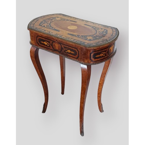 400 - A 19th Century French marquetry inlaid worktable, the hinged top enclosing a divided interior raised... 