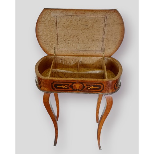 400 - A 19th Century French marquetry inlaid worktable, the hinged top enclosing a divided interior raised... 