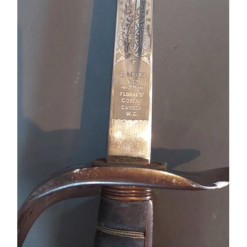 219 - A Victorian officers sword with pierced hilt and metal scabbard with two suspension rings, the blade... 