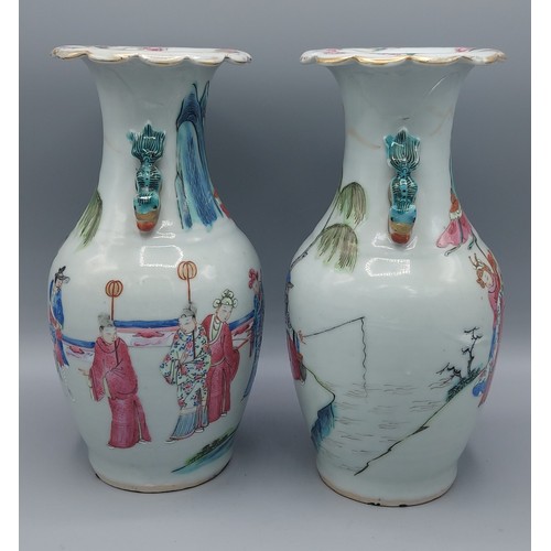 10 - A pair of Canton vases decorated in polychrome enamels and highlighted with gilt with figures fishin... 