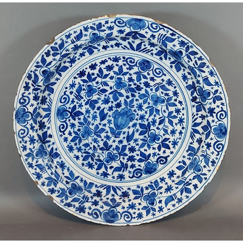 16 - An 18th Century Delft blue and white decorated deep dish, 34cms diameter