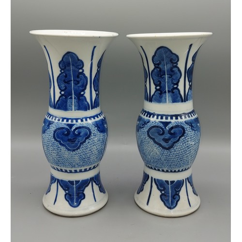 25 - A pair of early 19th Century Chinese flared rim vases, underglaze blue decorated with serpents and f... 