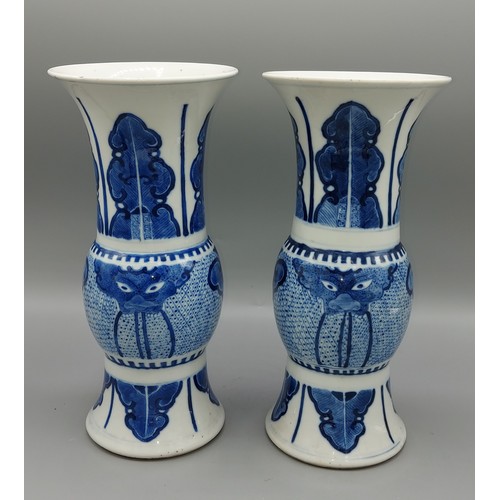 25 - A pair of early 19th Century Chinese flared rim vases, underglaze blue decorated with serpents and f... 