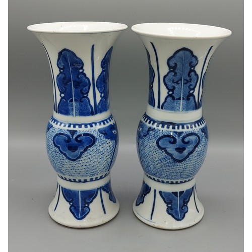 25 - A pair of early 19th Century Chinese flared rim vases, underglaze blue decorated with serpents and f... 