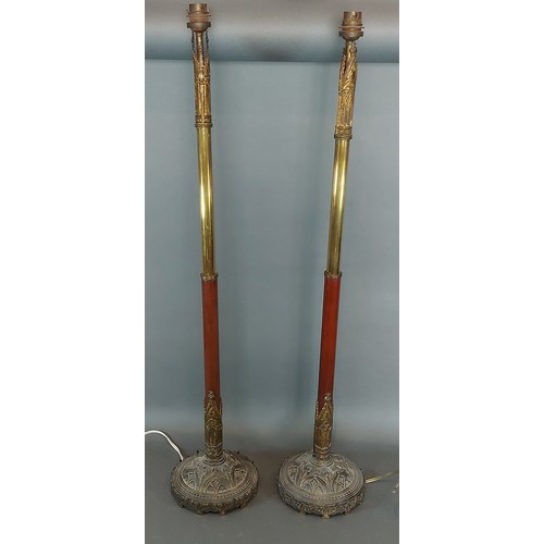 235 - A pair of patinated metal Days Patent telescopic candlesticks converted to table lamps, with gilded ... 