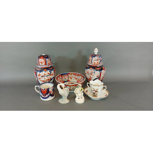 28 - A Dresden Augustus Rex hot chocolate cup and saucer, together with a pair of Imari decorated vases, ... 