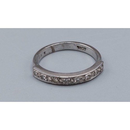 143 - An 18ct white gold and diamond set half eternity ring, ring size L, 3.7gms