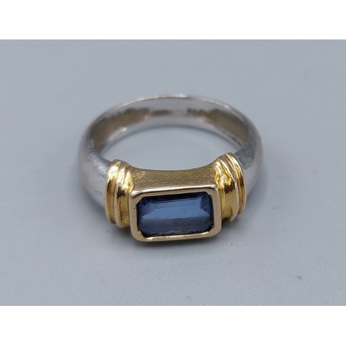 144 - An 18ct two tone gold Sapphire ring, set with single rectangular Sapphire, ring size F, 3.7gms