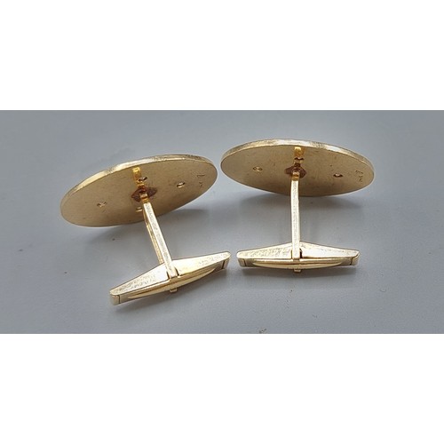 154 - A pair of 14ct gold and Diamond set cufflinks, each set with four diamonds within engraved decoratio... 