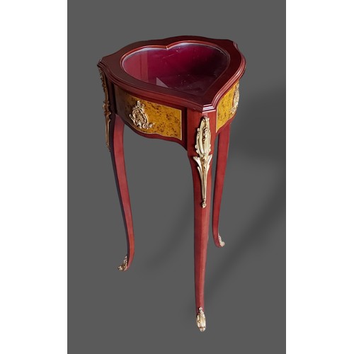 409 - A Bijouterie of heart form by Faberge Heirloom, the hinged top above gilt metal mounted cabriole leg... 