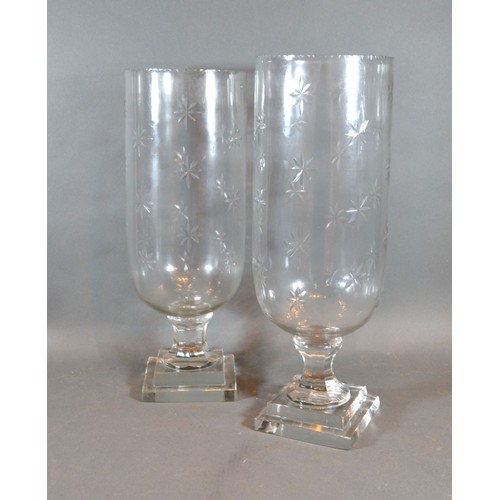 38 - A Pair of Cut Glass Storm Lamps with star cut decoration, 40 cms tall