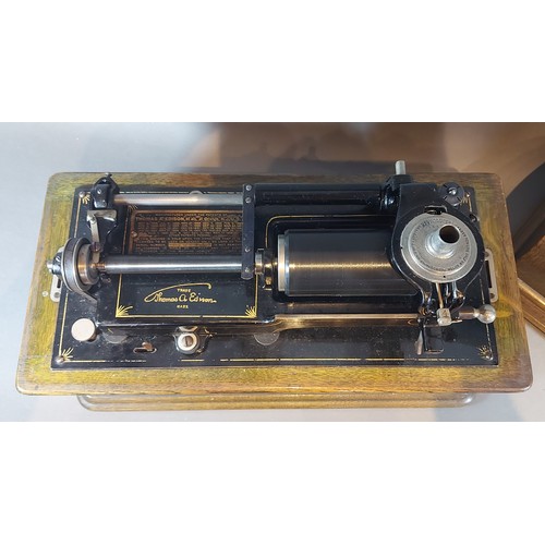 259 - An Edison Home Phonograph serial number H105519 together with a collection of cylinders within a pin... 