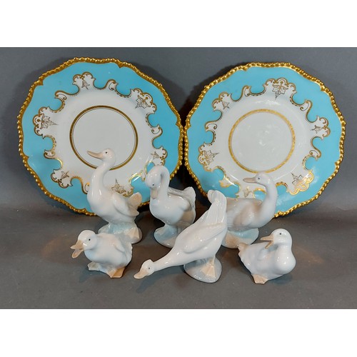 57 - A pair 19th Century gilded plates together with six Nao ducks