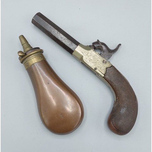 304 - A 19th Century percussion pocket pistol, 16.5cms long together with a copper shot flask