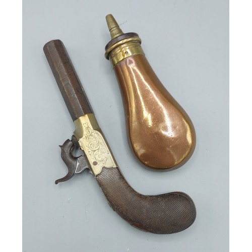 304 - A 19th Century percussion pocket pistol, 16.5cms long together with a copper shot flask