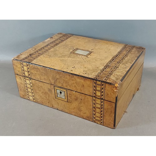 305 - A 19th Century walnut workbox, the hinged cover enclosing a fitted interior, the contents to include... 