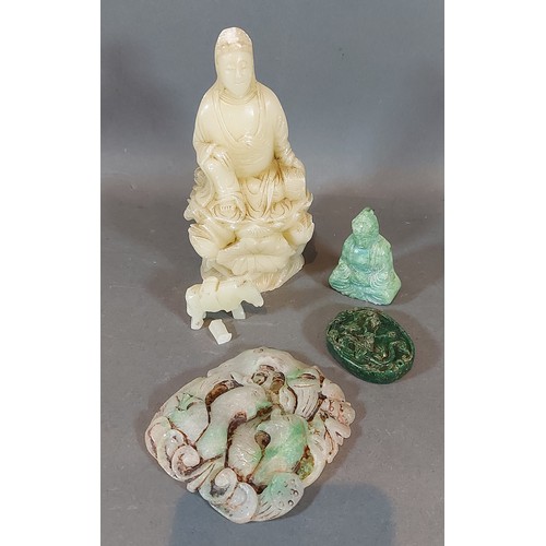 312 - A carved soapstone figure of Guan Yin, together with four other carved stone items