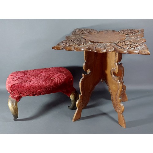 427 - A small foot stool with horn legs together with a carved hardwood occasional table