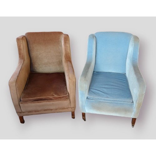 428 - A near pair of upholstered arm chairs raised upon low square legs