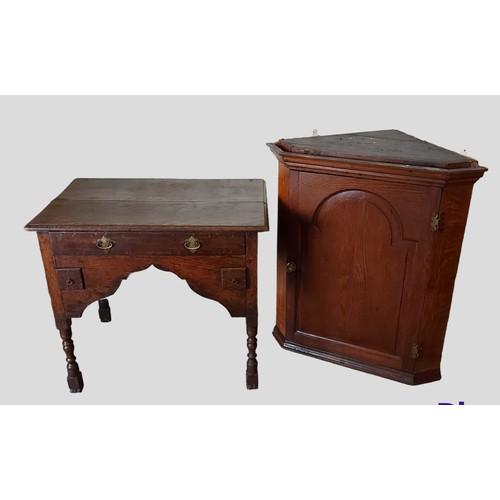 434 - A 19th Century oak lowboy together with a George III oak hanging corner cabinet