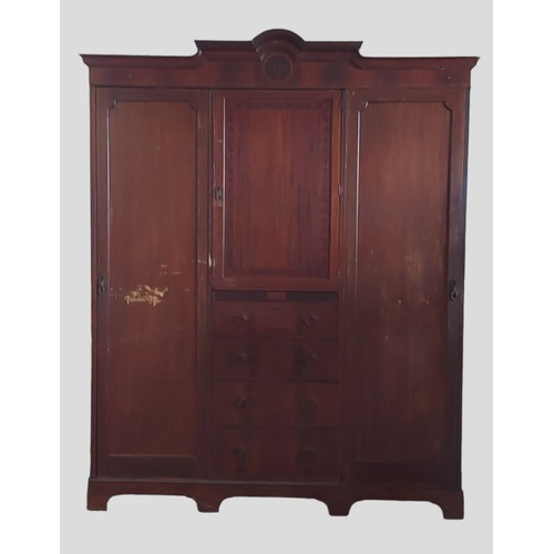 452 - DONATE   An Edwardian mahogany and satinwood inlaid wardrobe, the moulded cornice above a central do... 