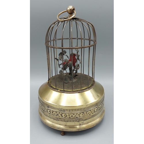 321 - An musical automaton bird cage with singing bird, 23cms tall