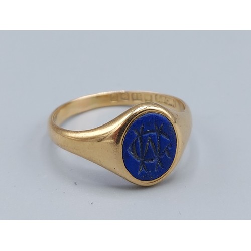 151 - An 18ct gold signet ring set blue stone, 3.8gms, ring size Q