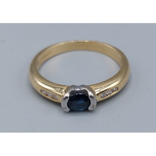 163 - An 18ct gold solitaire Sapphire ring with Diamond shoulders, ring size P, 4gms