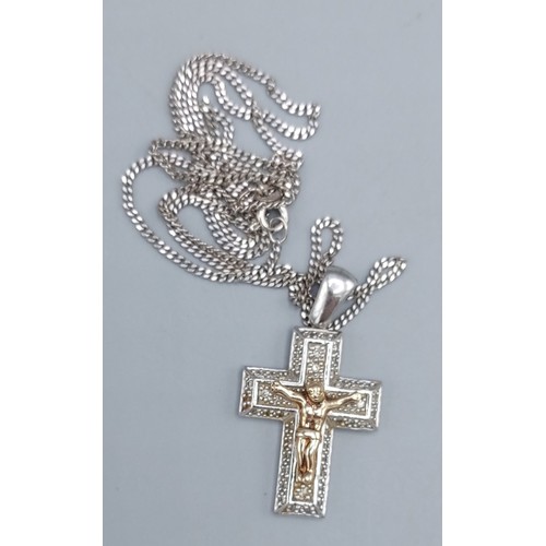 172 - A 9ct white gold crucifix pendant set with diamonds, together with a 9ct gold chain, 9.9gms