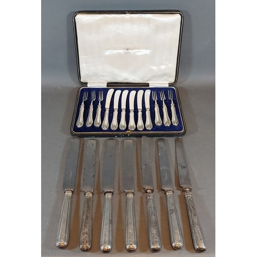 A set of six dessert knives and forks with silver handles within fitted ...