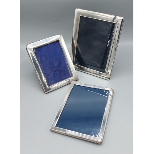 A London silver rectangular photograph frame, 22cms x17cms together ...