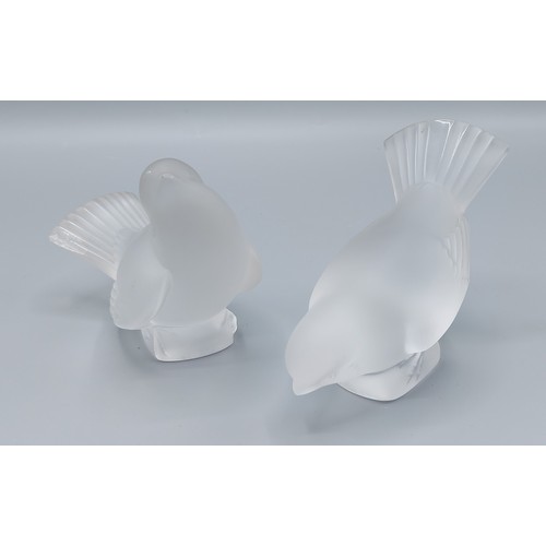 65 - A Lalique glass paperweight in the form of a bird together with another similar Lalique glass paperw... 