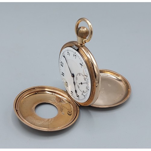 91 - A 9ct gold cased half hunter pocket watch, the enamel dial with Arabic numerals and subsidiary secon... 